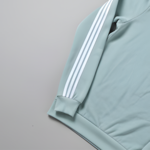 mint green quarter zip sweatshirt with white triple stripes